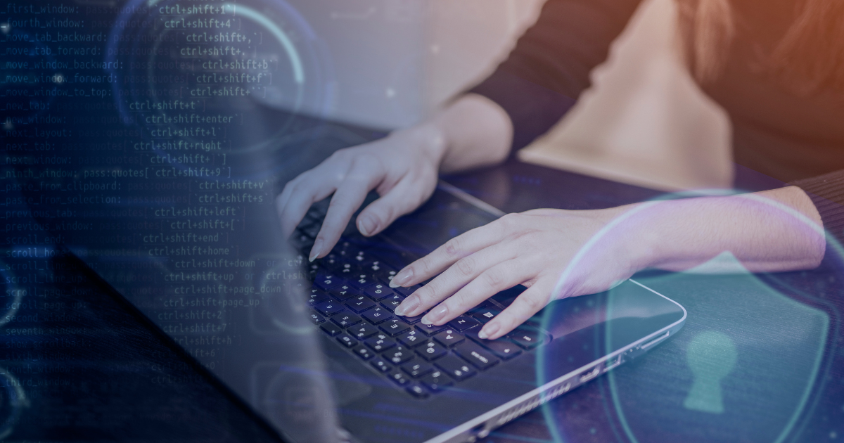 Girl typing on her laptop during Cybersecurity Awareness Month.